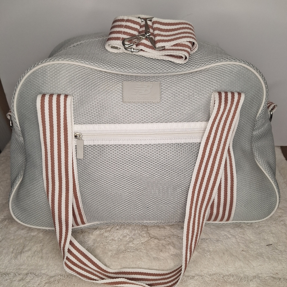 DSW New Balance Duffle bag with stripes handles.